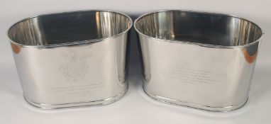 A PAIR OF OVAL CHAMPAGNE COOLERS. 16ins wide.