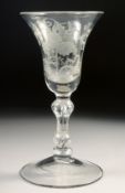AN 18TH CENTURY WINE GLASS with inverted bell bowl, engraved with vines. 6ins high.
