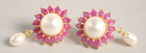 A PAIR OF SILVER, GOLD PLATED PEARL AND RUBY EARRINGS.