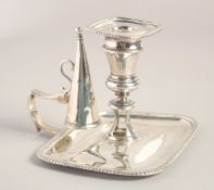 A GEORGE III RECTANGULAR CHAMBER CANDLESTICK AND SNUFFER with graduated edge. 5.5ins wide. London