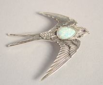 A SILVER OPAL SET SWALLOW BROOCH.