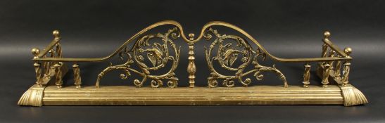 A VERY GOOD 19TH CENTURY BRASS FENDER, pierced front with acanthus, fruiting vines and birds 4ft