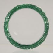 A CARVED JADE BANGLE. 2.75ins.