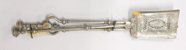 A PAIR OF STEEL FIRE IRONS.