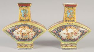 A PAIR OF CHINESE PORCELAIN FAN SHAPED VASE. 8.5ins high.