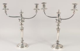 A GOOD PAIR OF MATTHEW BOLTON SHEFFIELD PLATE THREE LIGHT CANDELABRAS, circular bases, tapering