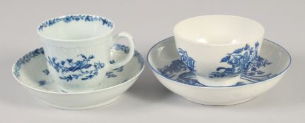 AN 18TH CENTURY WORCESTER FEATHER MOULDED COFFEE CUP AND SAUCER painted in under glaze blue,