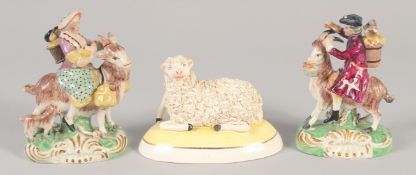 A 19TH CENTURY STAFFORDSHIRE FIGURE OF THE WELSH TAILOR AND COMPANION together with a later sheep.