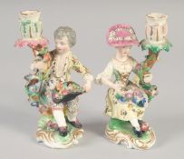 AN EARLY 19TH CENTURY DERBY PAIR OF CANDLESTICK FIGURES.