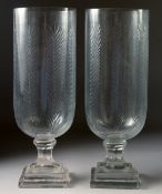 A GOOD PAIR OF CUT GLASS STORM LAMPS on square stepped bases. 15ins high.