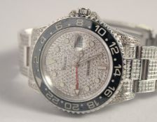A ROLEX GMT MASTER II GENTLEMAN'S WATCH with diamond face and bracelet. Boxed in an outer cream