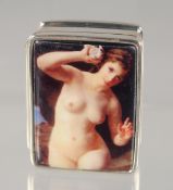 A SMALL MODERN SILVER PILL BOX, with enamel decoration of a reclining female nude. 3cm x 2.5cm.