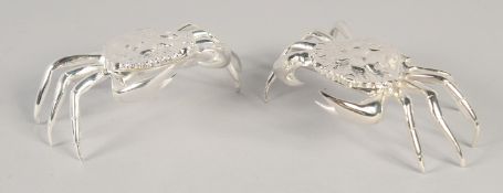 A PAIR OF SILVER PLATED CRAB SALTS.