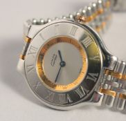 A CARTIER STAINLESS STEEL AND GOLD WRISTWATCH. No. 1330.