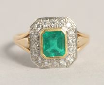 AN 18CT YELLOW GOLD COLUMBIAN EMERALD AND DIAMOND RING.