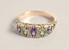 A 9CT GOLD AMETHYST, PERIDOT AND DIAMOND RING.