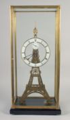 A LARGE EIFFEL TOWER SKELETON CLOCK with enamel dial, in a glass case.