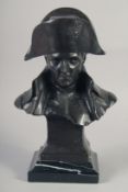 A BRONZE BUST OF NAPOLEON on a marble base. 14ins high.