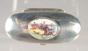 A SMALL SILVER OVAL PILL BOX with an enamel oval of The Hunt. 0.75ins x 1.75ins.