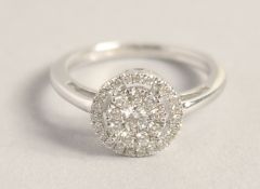 A GOOD 9CT GOLD DIAMOND CIRCULAR RING.