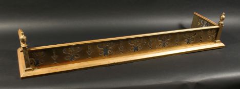 A 19TH CENTURY BRASS FENDER with pierced fretwork front and urn finials 4ft 2ins long, 1ft 1ins
