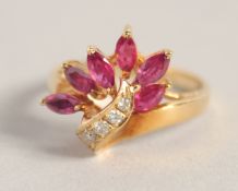 A GOLD, RUBY, AND DIAMOND RING.