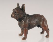 A CAST BRONZE MODEL OF A DOG. 7.5cm long.