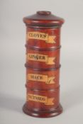 A WOODEN CIRCULAR SPICE TOWER 