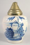 A DUTCH DELFT VOC LARGE TOBACCO JAR painted in blue with a smoking man seated next to a tobacco