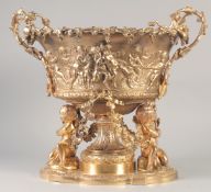 A SUPERB GILT BRONZE CHERUB CENTRE PIECE hung with fruiting vines and cupids. 16ins high x 16ins