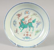 A CHINESE DOUCAI PORCELAIN DISH with Kylin and lucky objects. 21.5cm diameter.