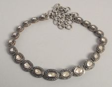 AN ANTIQUE ROSE DIAMOND NECKLACE set with twenty graduated rose diamonds.