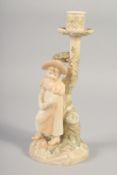 A LATE 19TH CENTURY ROYAL WORCESTER HADLEY STYLE BLUSH IVORY CANDLESTICK FIGURE OF A GIRL,