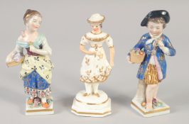 A 19TH CENTURY STAFFORDSHIRE PORCELAIN FIGURE OF A GIRL wearing a hat. and A PAIR OF CONTINENTAL