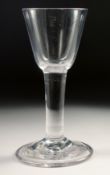 A PLAIN 18TH CENTURY HEAVY WINE GLASS with plain stem. 6ins high.
