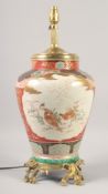 A GOOD MID 20TH CENTURY KUTANI PORCELAIN LAMP painted with birds with ormolu base. 16ins high.