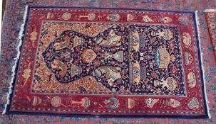 AN UNUSUAL PERSIAN CARPET, rich ground and deep red border, all with Persian and Islamic bowls,