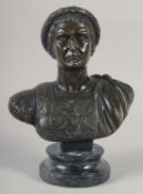 A BRONZE BUST OF CAESAR on a marble base. 11ins high.