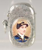 A VICTORIAN ENGRAVED SILVER VESTA CASE with an oval enamel of the jockey, Fred Archer. 1.75ins x