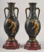 A VERY GOOD PAIR OF BRONZE AND GILDED BRONZE TWO HANDLED VASES with oval panels of a nude and