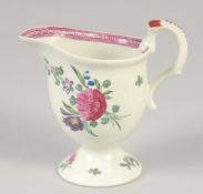 An 18TH CENTURY LIVERPOOL JUG painted with scattered spray and sprigs of flowers with internal