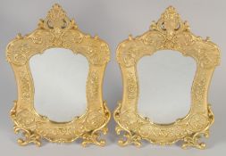 A PAIR OF GILT BRONZE EASEL STANDING MIRRORS. 12ins x 7.5ins.
