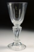 AN 18TH CENTURY WINE GLASS with pedestal stem. 5.75ins high.