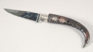 A ROSTFREI SOLINGEN KNIFE, with curved horn handle.