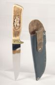 A KNIFE, with antler handle carved with a moose head, 9