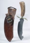 AN OLD KNIFE, with an engraved blade and antler handle, 11