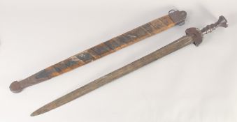 A THEATRICAL REPLICA OF AN IRON AGE SWORD, early 20th century, wide tapering double fullered pointed