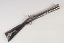 A LARGE INDIAN BLUNDERBUSS, mid-19th century, 32in long. Engraved two stage barrel with wide muzzle,