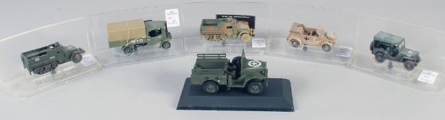 SIX VARIOUS DIECAST ARMORED VEHICLES, in a Perspex case.
