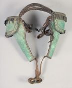 A PAIR OF AMERICAN INDIAN/CIVIL WAR PERSONAL POMMEL HOLSTERS, late 19th century, green leather, with